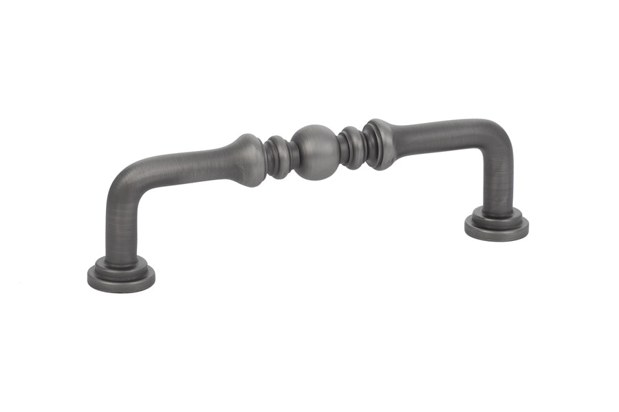 Decorative metal cabinet handle on a white background